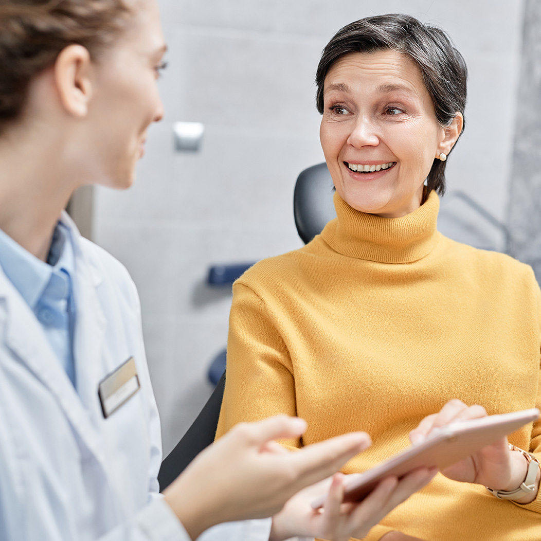 Dental Implant patient talking to her Oral Surgeon