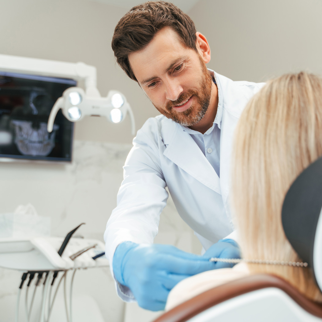 an oral surgeon consulting a jaw surgery patient