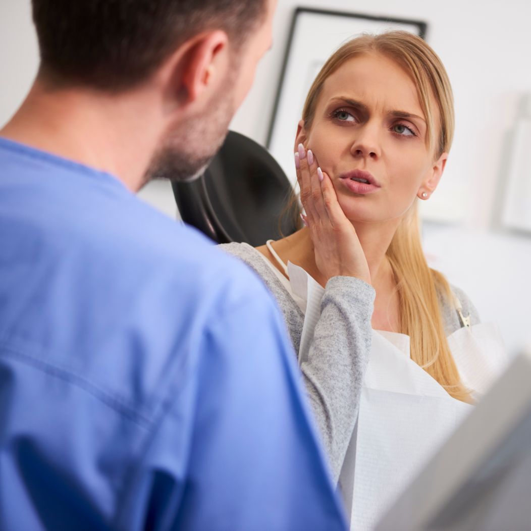 an oral surgery patient receiving an oral cancer screening