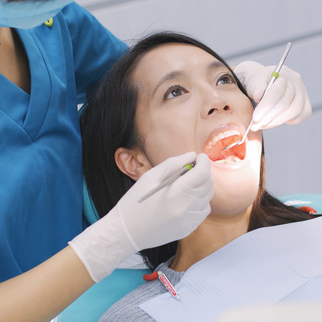 an oral surgery patient receiving an oral cancer screening
